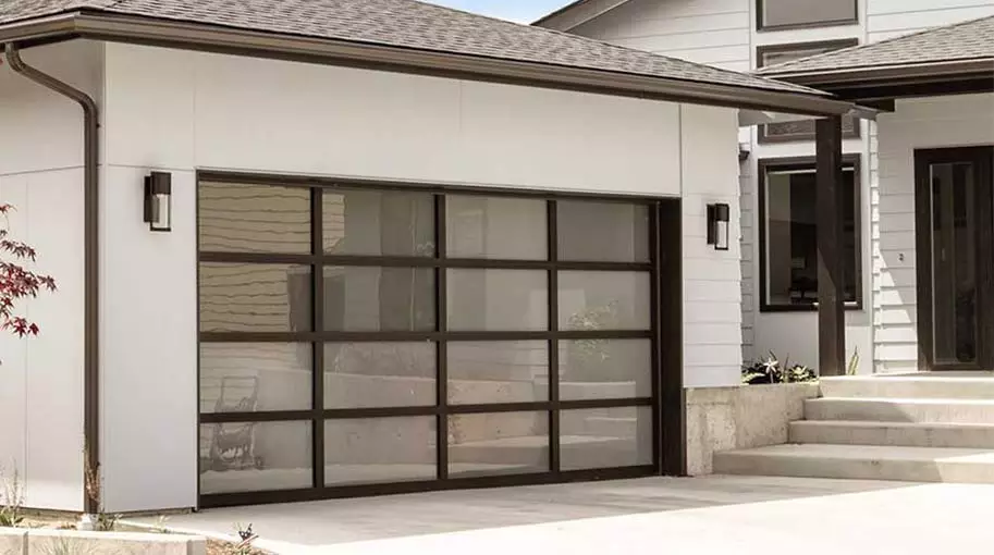 Modern aluminum glass garage door on a residential home